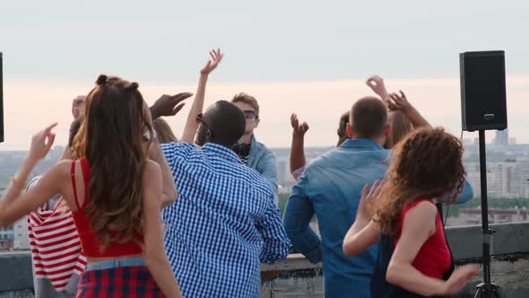 Diverse People Clubbing at Rooftop Dj Performance
