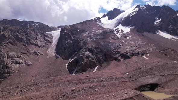 High Rocky Mountains Covered with Ice in Places