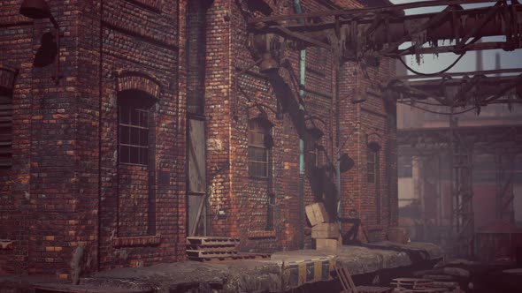 Abandoned Industrial Factory Buildings at Sunset alt