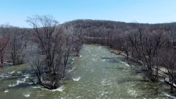 Aerial view over fox and forest during early spring river in Wisconsin