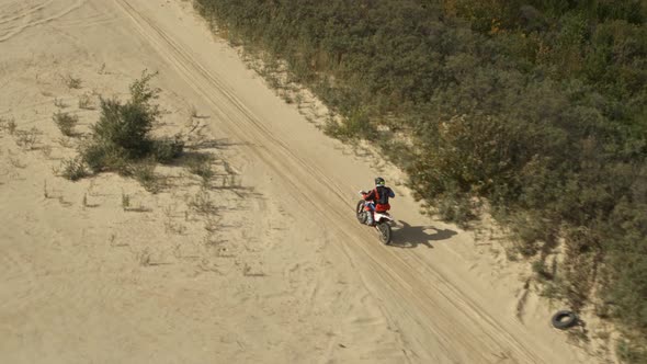 Enduro Motorcycle Rides Offroad on the Sands