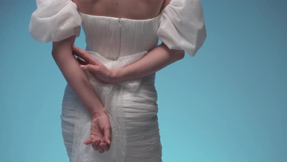 Beautiful Female Hands and White Dress