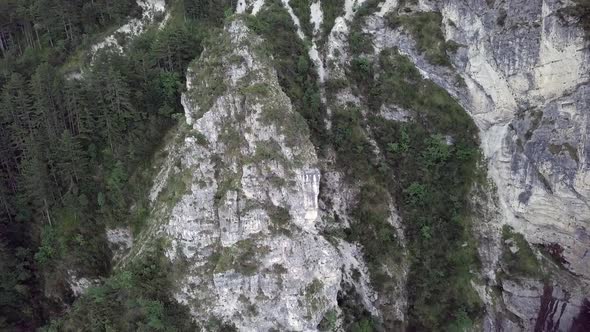 Aerial view of the mountains and forest in Borgo Valsugana in Trentino Italy with drone flying forwa