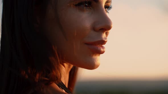 Close Up Portrait of an Elegant Woman at Sunset in Black Dress