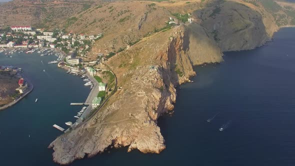 Drone View of Steep Cliffs and the Remains of a Ruined Fortress