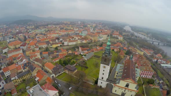 Aerial Panorama of Old City Downtown, City Hall Tower, Mountains on Horizon