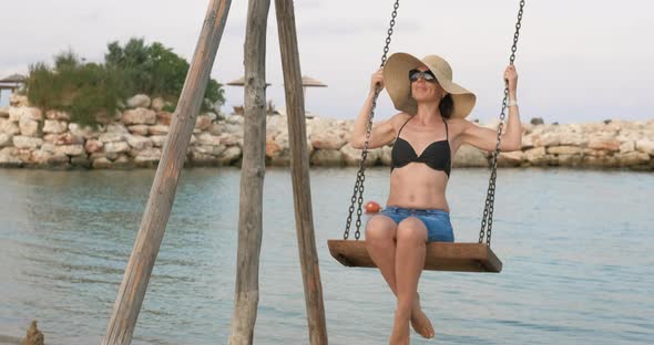 Playing with a Swing on Beach