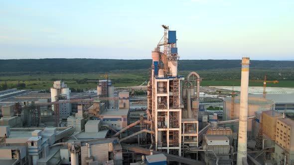 Cement Plant with High Factory Structure and Tower Cranes at Industrial Production Area