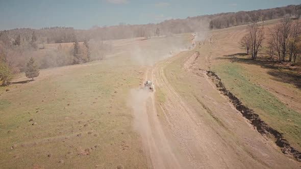 Arial cinematic shot of a 4x4 off-roading cars