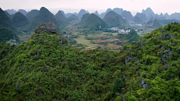 Aerial of the rock formations and towns along the Li River in China