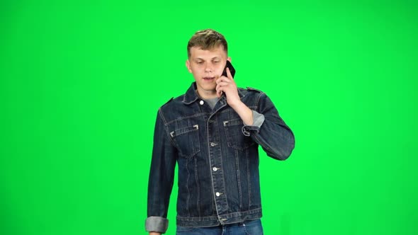 Friendly Guy Goes and Talks on the Phone, Chroma Key. Slow Motion