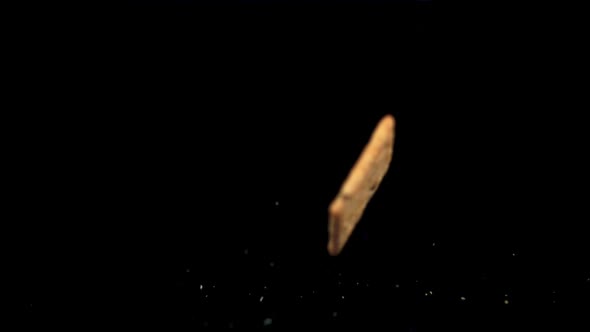 Super Slow Motion Cookies with Sesame Seeds Falls on the Table