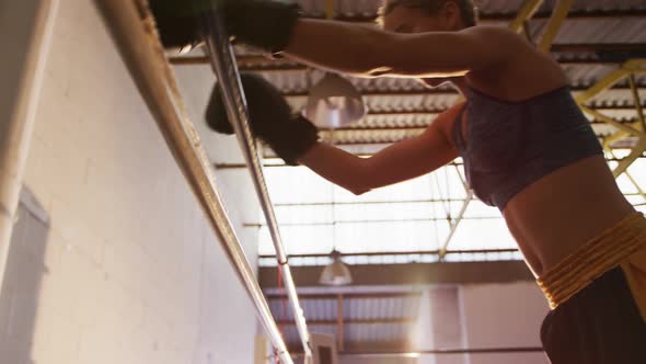 Close up view of fit woman in boxing gym