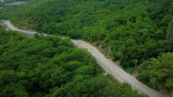 Drones Eye View - Winding Road From the High Mountain Pass To Crimea. Great Road Trip.