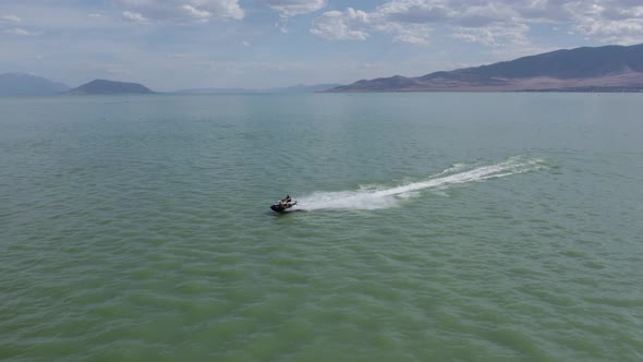 Sea-Doo Jet Ski In Tropical Utah Lake With Mountains And Beautiful Sky