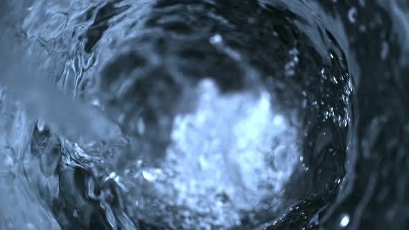 Super Slow Motion Shot of Pouring Water Into Water Vortex at 1000 Fps