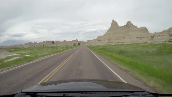 Roof mounted shot from a car driving through the Badlands.