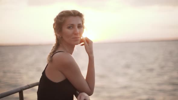 Blond Female with Braid Smiling Romantic Look Boat Trip During Sunset Windy Weather