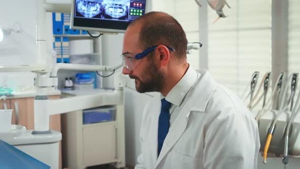 Close Up of Stomatologist Talking with Woman