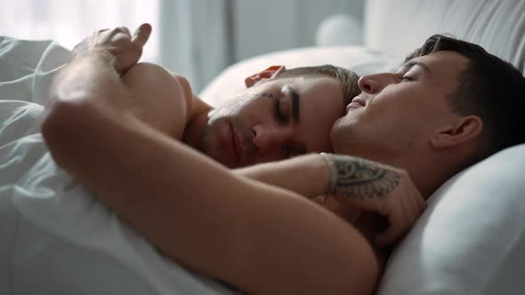 Closeup Happy Caucasian Gay Couple Sleeping in Bed at Home Hugging