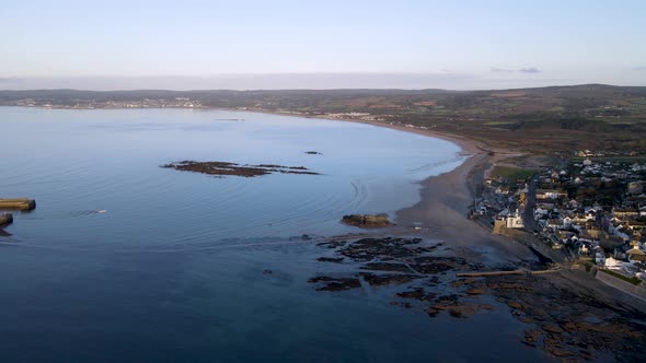 Stunning aerial panoramic view of Marazion village and St Michaels Mount during high tide, Cornwall