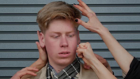 Guy Student Among the Palms of Hands