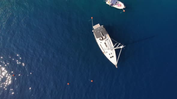 Camera Rises Above a Yacht at The Ocean Beach