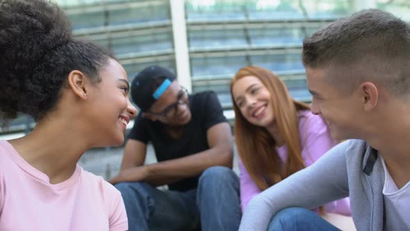 Young Carefree Mixed-Race Friends Laughing and Having Fun Outdoors, Summer Relax