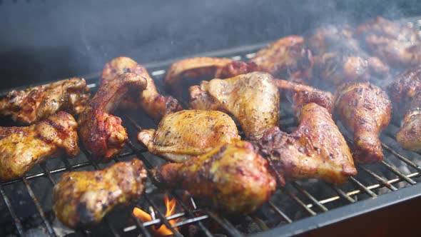 Delicious Chicken Pieces Frying on Barbecue Grill