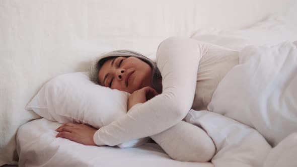 Dreaming Asian woman sleeping