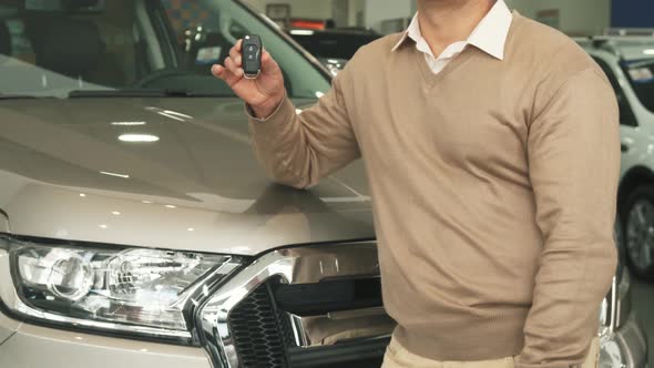 Stylish Man Picks Up the Keys To the Car and Shows Thumbs Up