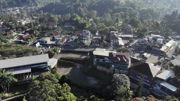 Cinematic overhead aerial view of suburban area located in puncak, Indonesia