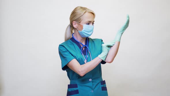 Medical Doctor Nurse Woman with Stethoscope Wearing Protective Mask and Rubber or Latex Gloves