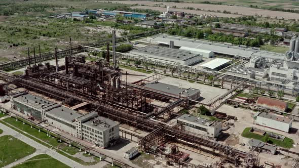 Aerial Wide View Flying Over Oil Refinery or Chemical Factory. Industrial Zone