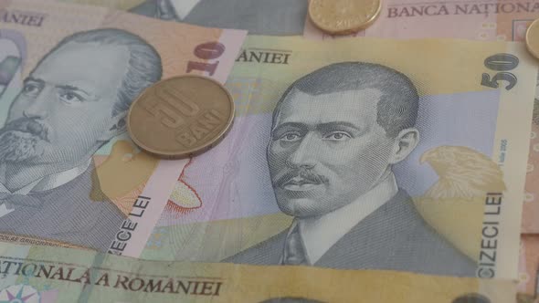 Close-up coins and paper money of Romania   3840X2160p 30fps UltraHD   tilting video - Romanian nati