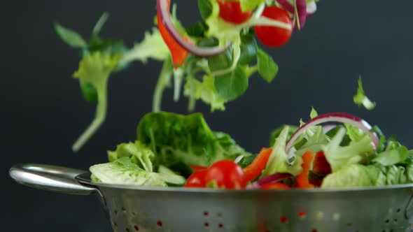 Fresh Salad Flying to Colander in Super Slow Motion