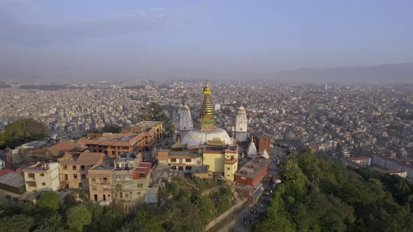 Flying into Swayambhunath Stupa viewing the city of Kathmandu