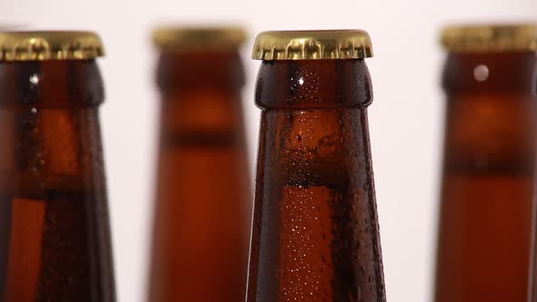 Bottle of Beer with Drops Isolated on White Background