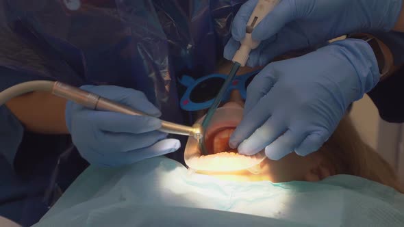 a Little Girl with an Oral Dilator at the Dentist's Appointment