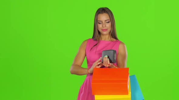 Woman with Credit Card and Shopping Bags. Green Screen