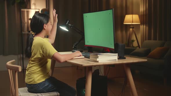 Asian Girl Learning Online, Raising Hand Distance With Mock Up Computer Green Screen