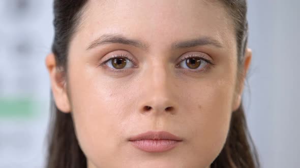 Woman Looking at Camera Through Magnifying Glass, Examining Information, Search