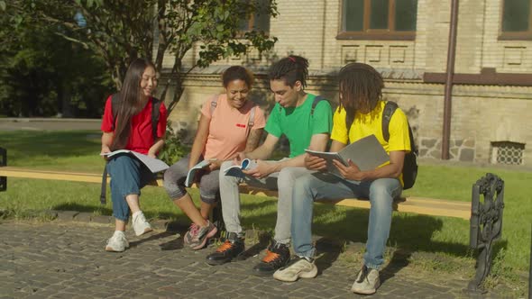 Diverse Students with Textbooks Learning at Campus