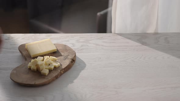 Man Put Vintage Cheese on Olive Wood Board