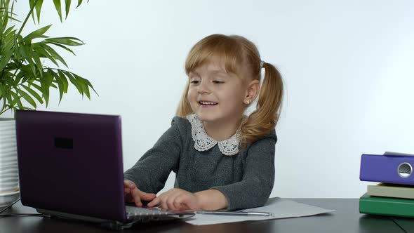 Online Learning, Distance Education, Lesson at Home. Girl Doing School Program Online on Computer