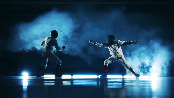 Fencing Match Between Two Men Shown in Slow Motion