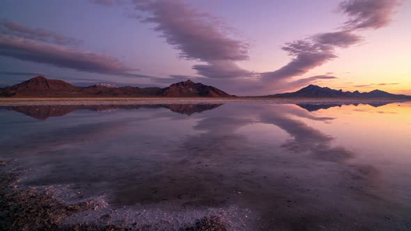 Time lapse of colorful sunrise reflecting over the Great Salt Lake