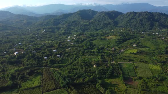 Village And Green Mountains In Summer