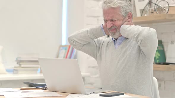 Old Man With Neck Pain at Work