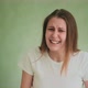 Emotional Doubting Lady Shrugs and Clutches Head on Green - VideoHive Item for Sale